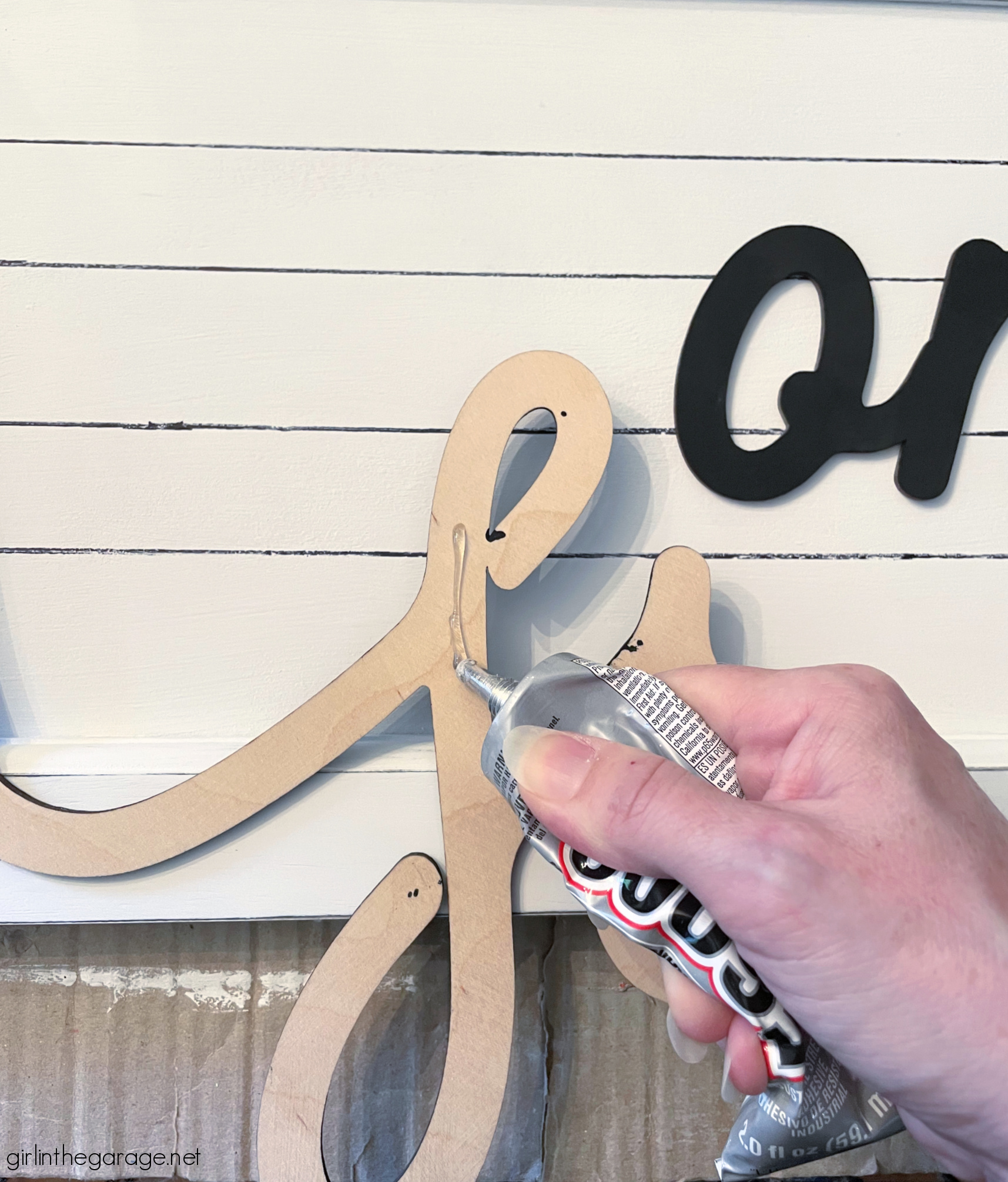 How to transform and repurpose old Goodwill art into a beautiful farmhouse-style sign for your home. Easy home decor ideas by Girl in the Garage