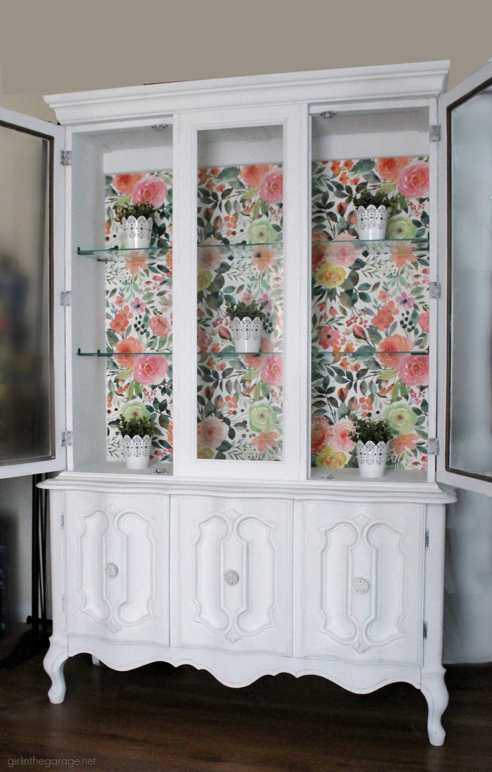 How to create a gorgeous painted china cabinet with wallpapered back. Full tutorial with photos by Girl in the Garage.