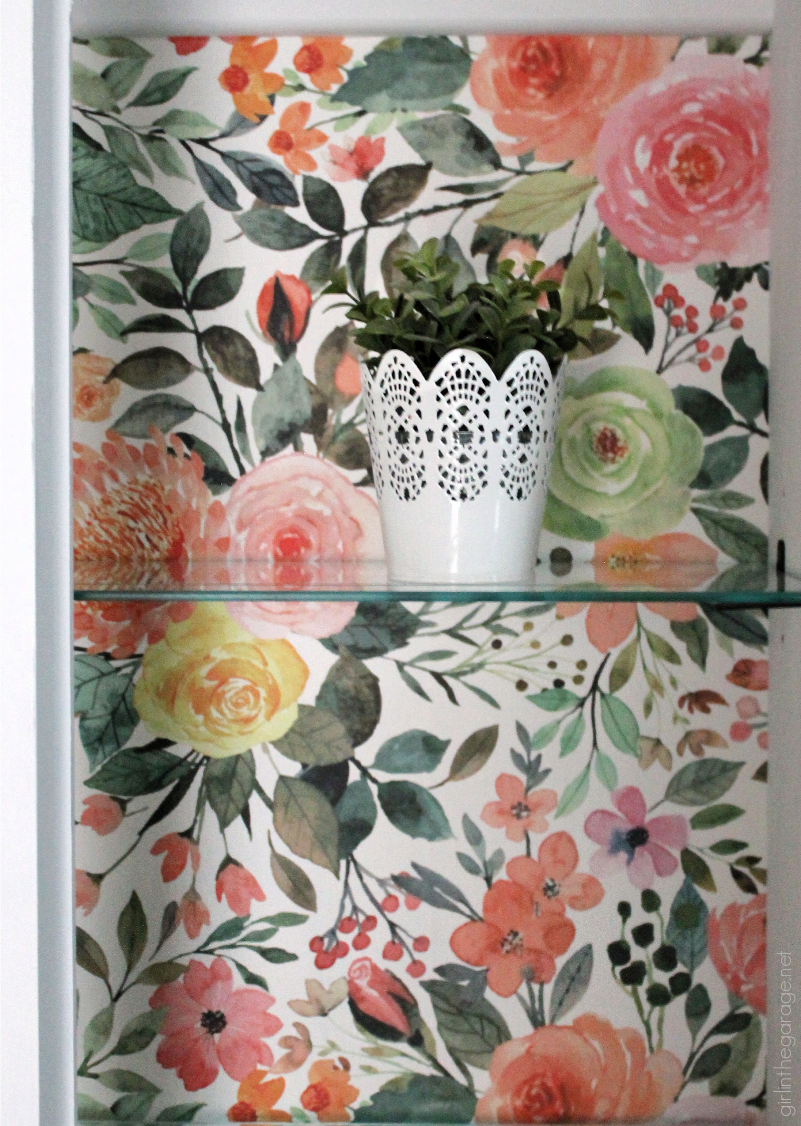 How to create a gorgeous painted china cabinet with wallpapered back. Full tutorial with photos by Girl in the Garage.