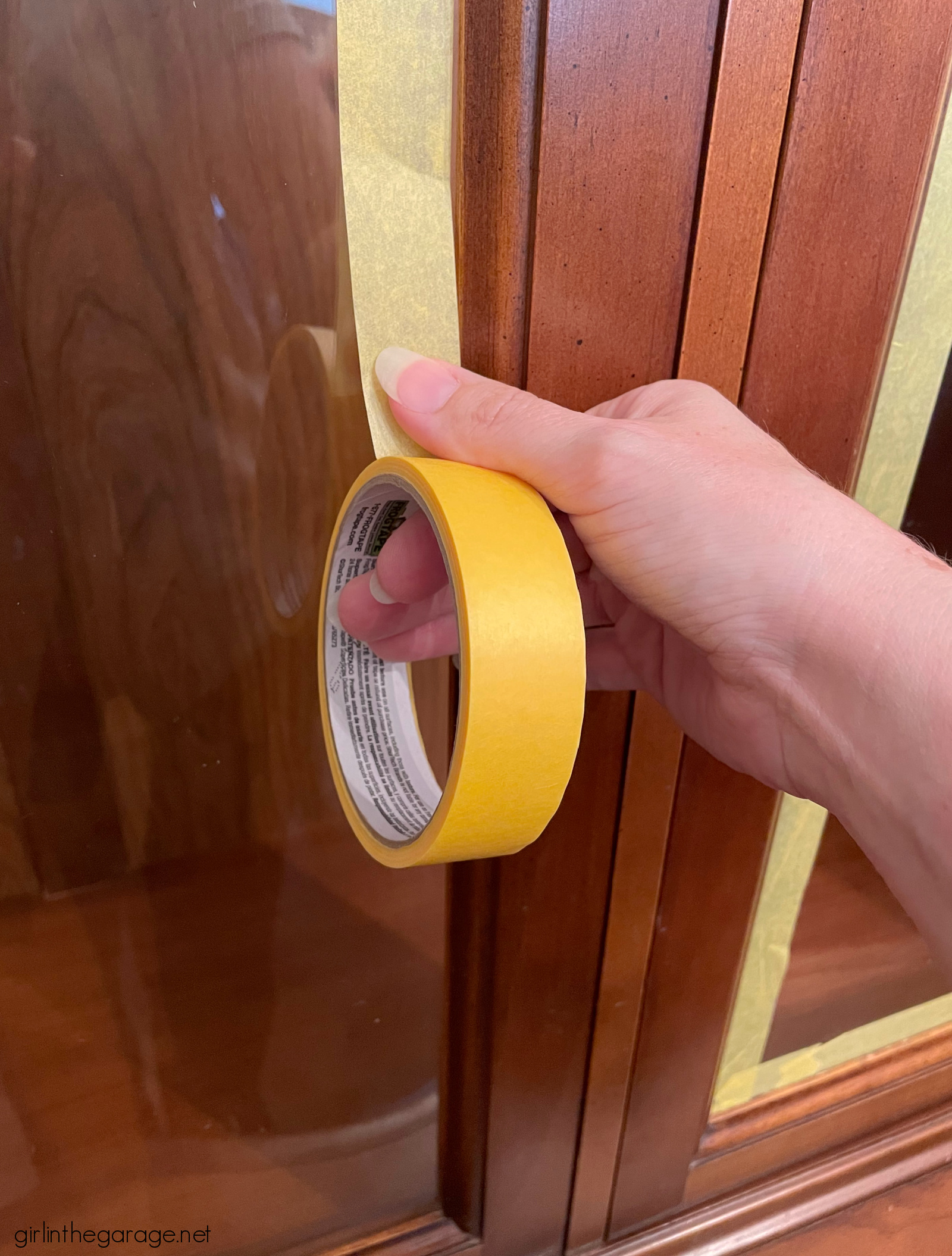 How to create a gorgeous painted china cabinet with wallpapered back. Full tutorial with photos by Girl in the Garage.