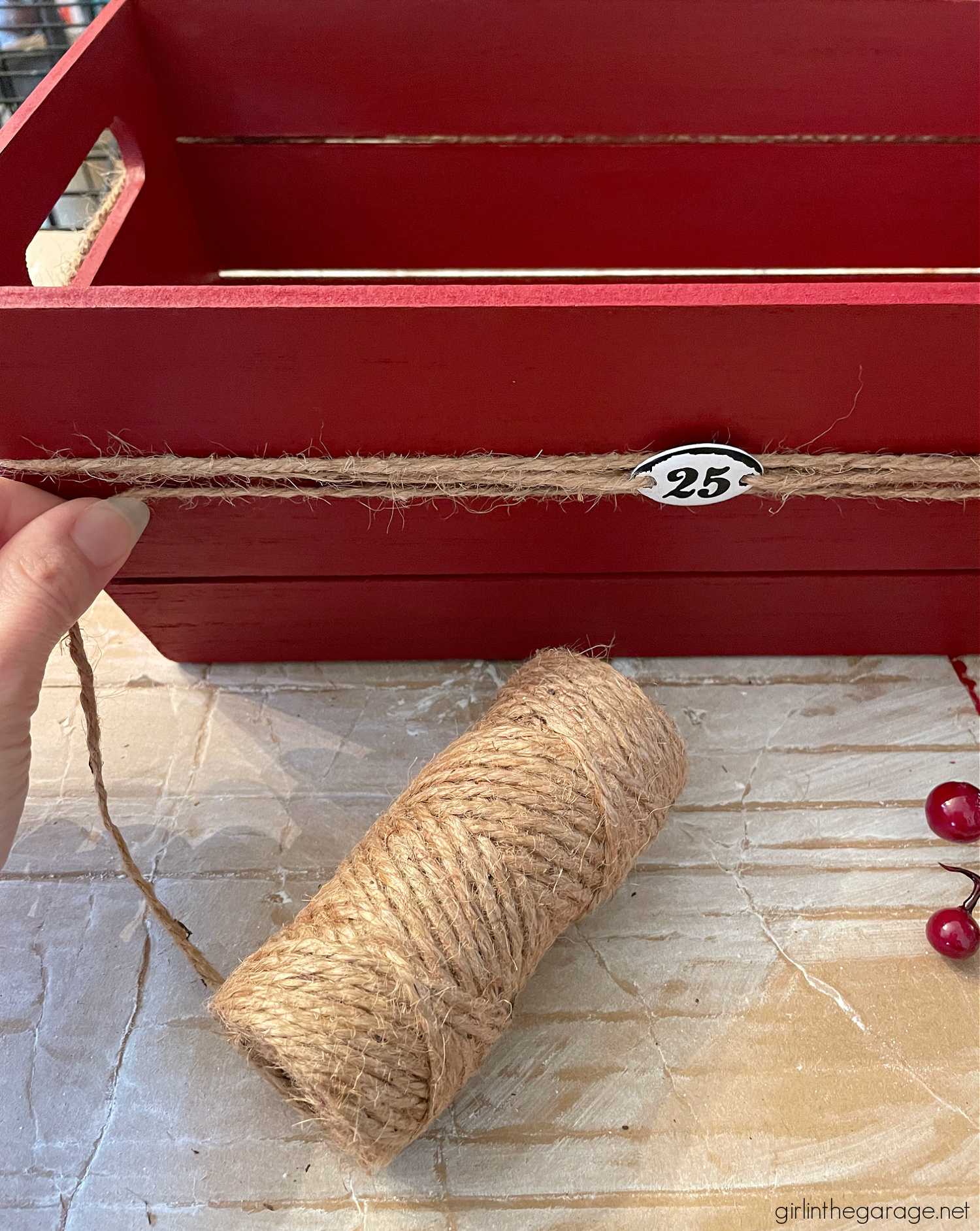 Learn how to transform a plain Target wood crate into a festive DIY Christmas card holder box with just a few supplies. Super cute Christmas decor idea by Girl in the Garage