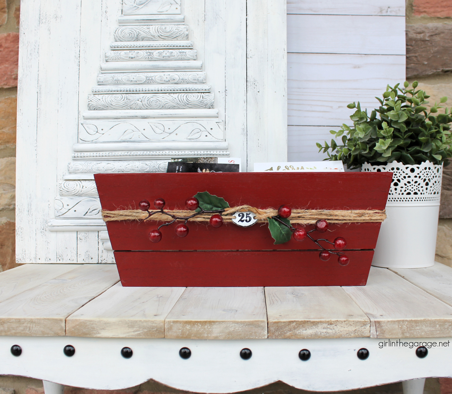 Learn how to transform a plain Target wood crate into a festive DIY Christmas card holder box with just a few supplies. Super cute Christmas decor idea by Girl in the Garage