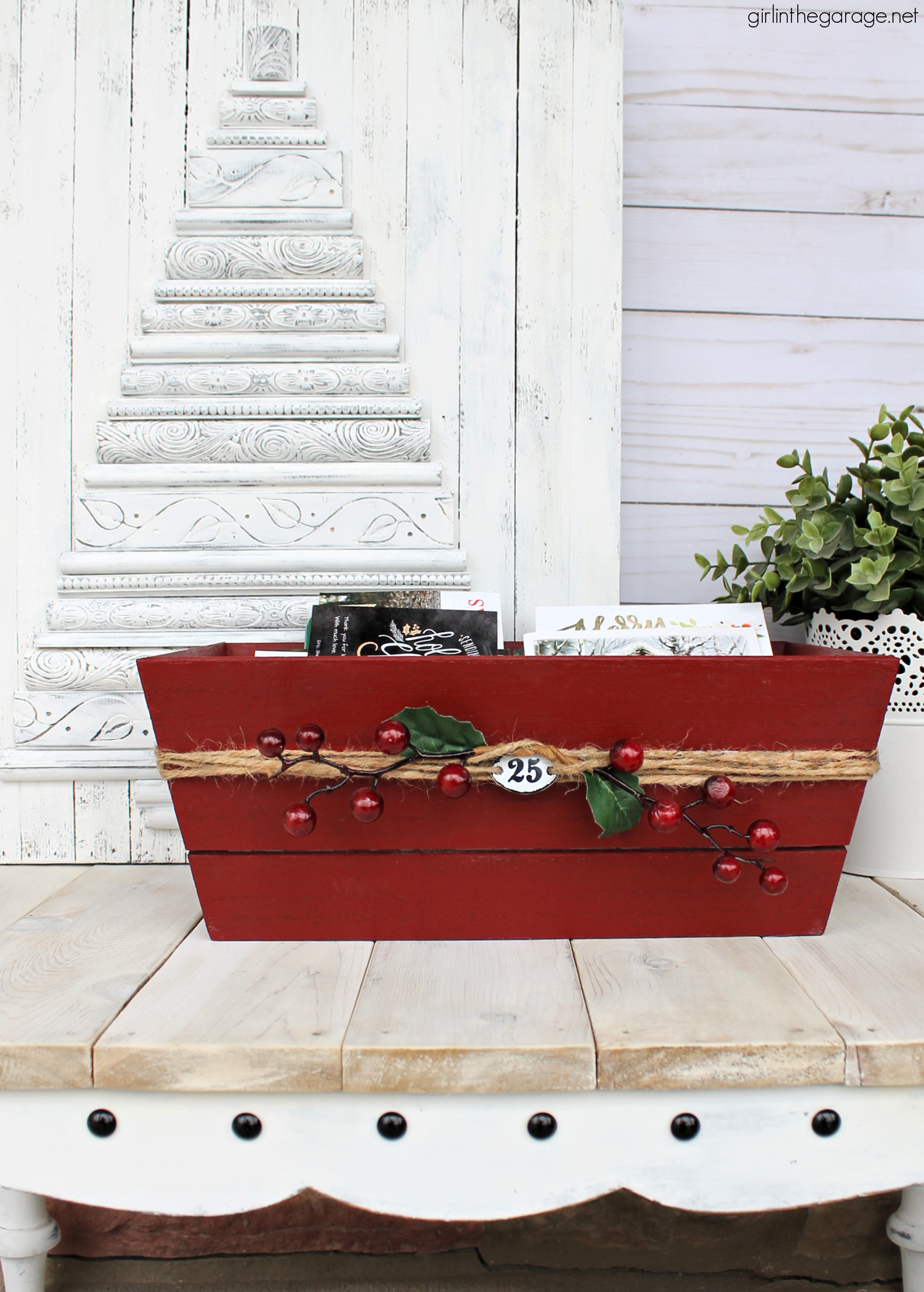 Learn how to transform a plain Target wood crate into a festive DIY Christmas card holder box with just a few supplies. Super cute Christmas decor idea by Girl in the Garage