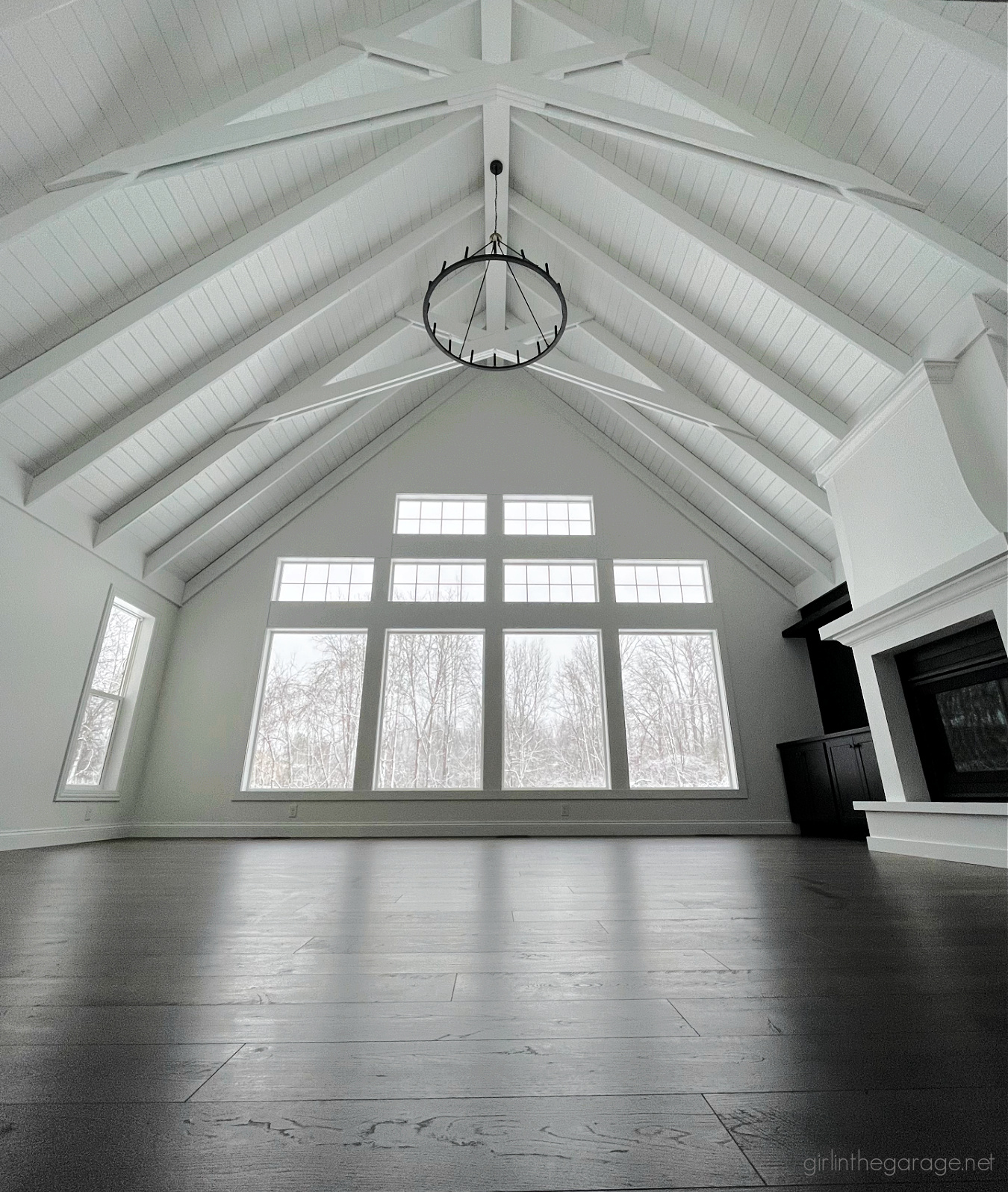 Transitional great room with vaulted ceiling and fireplace - Girl in the Garage