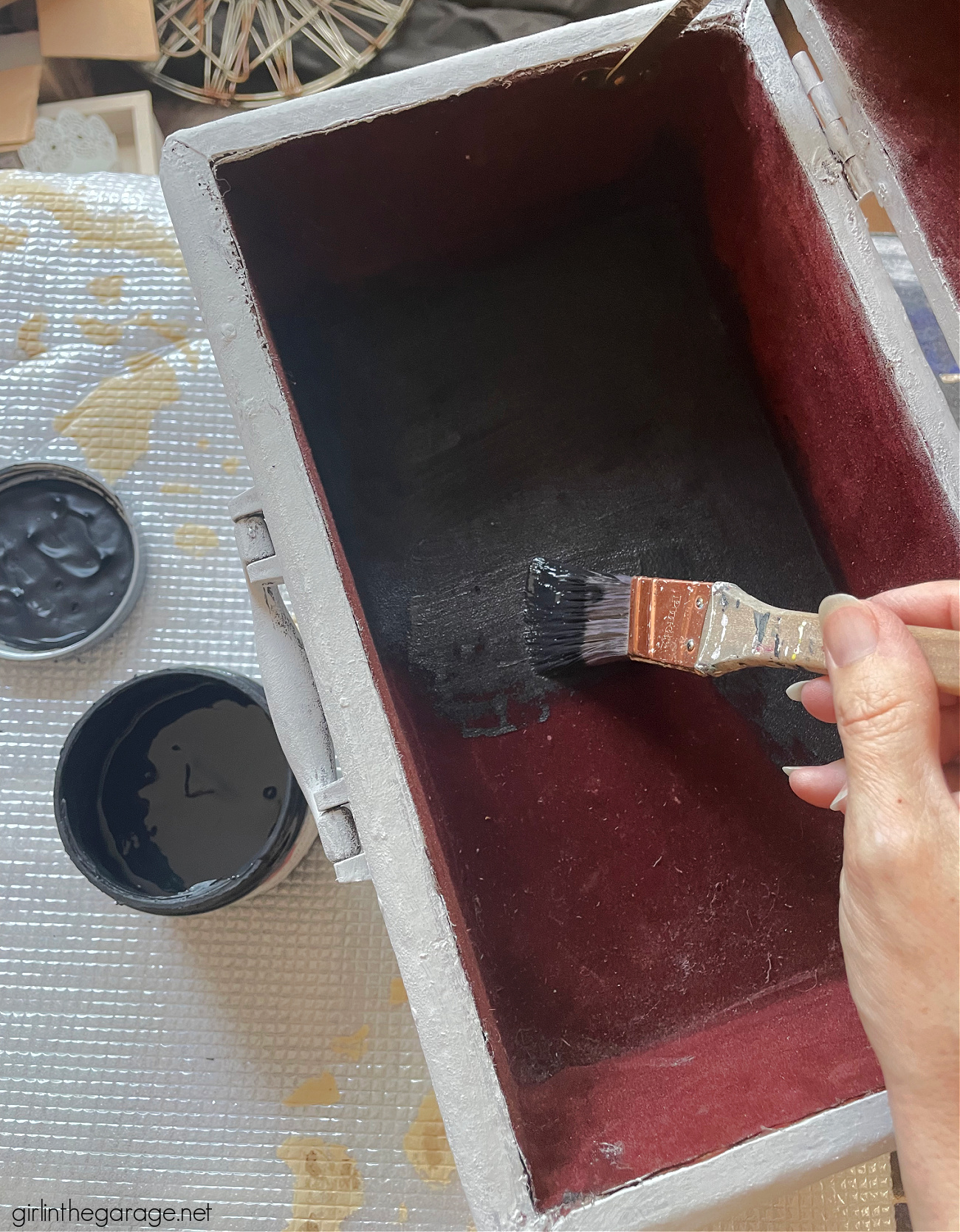 Learn how to paint a leather suitcase as beautiful custom decor for your home. Step by step painting tutorial by Girl in the Garage.