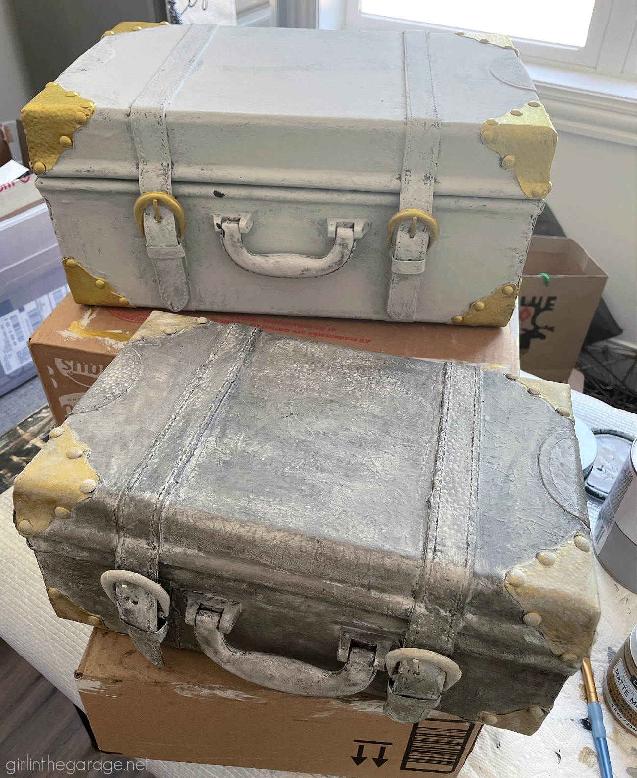 Learn how to paint a leather suitcase as beautiful custom decor for your home. Step by step painting tutorial by Girl in the Garage.