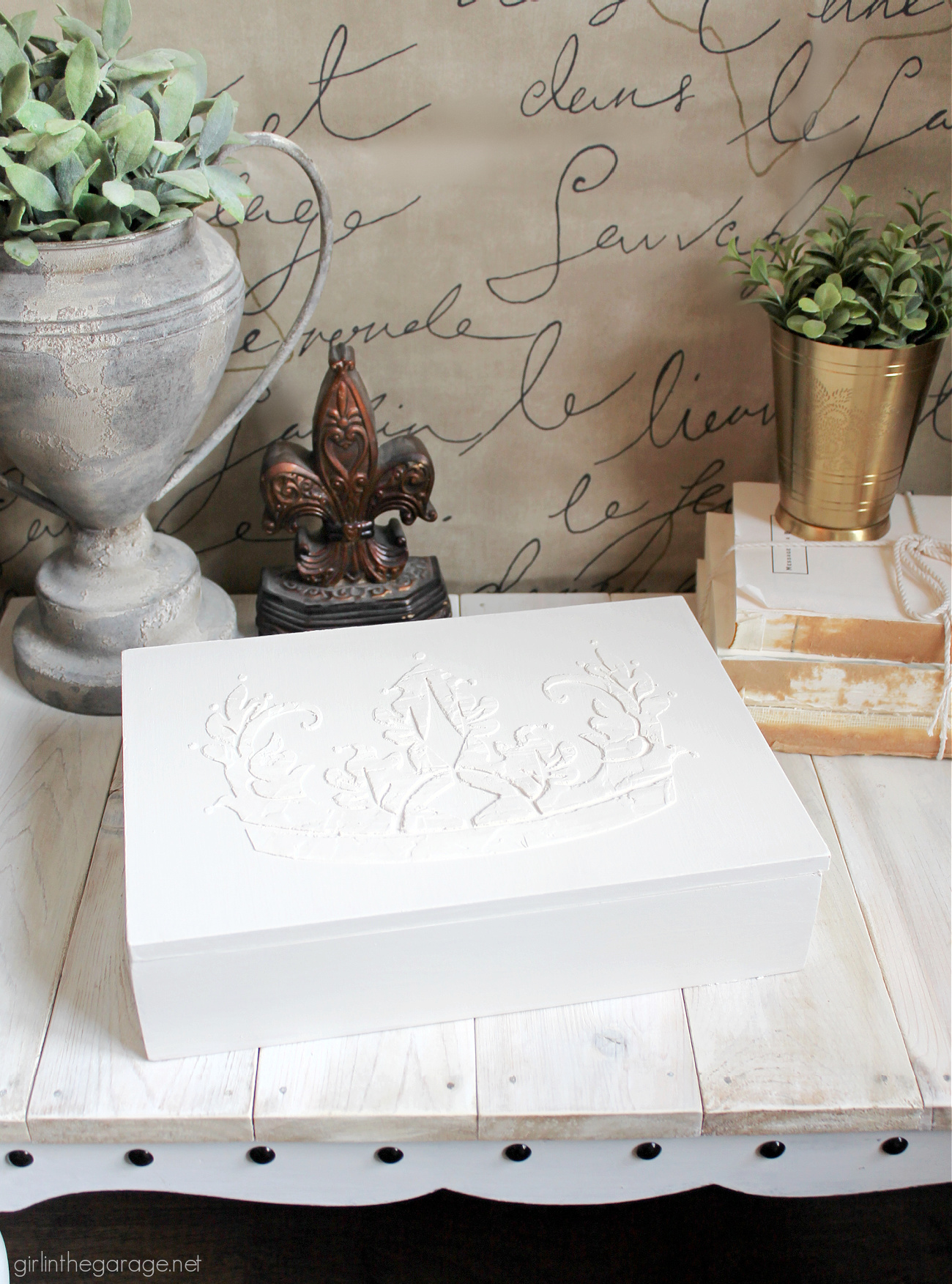 Learn how to paint a box and add a raised stencil for a stunning custom design. Step by step tutorial by Girl in the Garage.