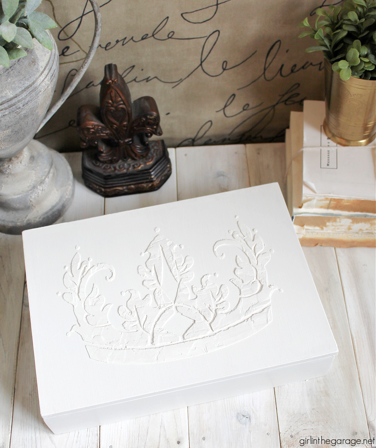 Learn how to paint a box and add a raised stencil for a stunning custom design. Step by step tutorial by Girl in the Garage.