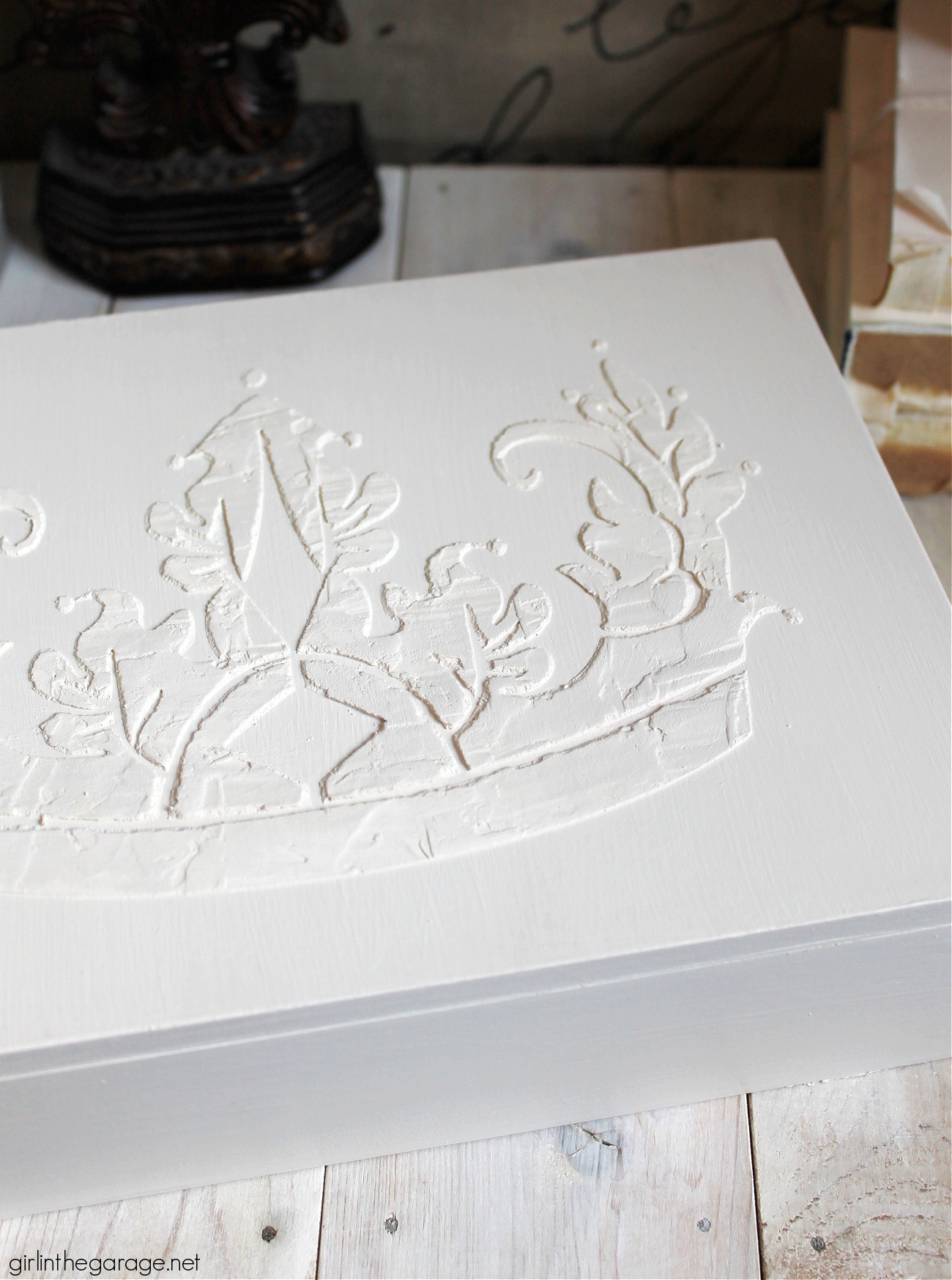 Learn how to paint a box and add a raised stencil for a stunning custom design. Step by step tutorial by Girl in the Garage.