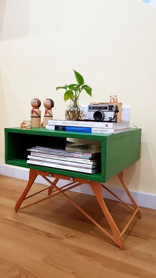 Wooden hangers used as table legs on a side table (original source unknown).