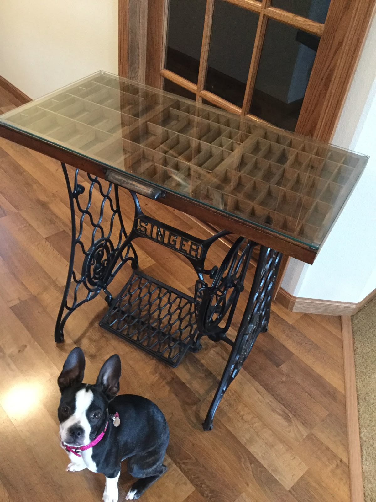 Black Singer sewing table base with antique printer cabinet drawer as top with glass