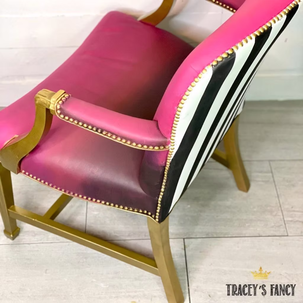 Painted leather chair with Dixie Belle paint in Peony and blended with other colors, painted stripes on the black, and Liquid Leaf Gold on the wood - by Tracey's Fancy Painted leather chair with Dixie Belle paint in Peony and blended with other colors, painted stripes on the black, and Liquid Leaf Gold on the wood - by Tracey's Fancy